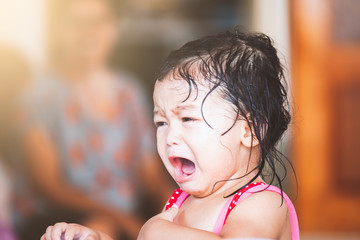 Fototapeta premium Sad asian little girl crying and upset