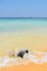 beautiful shading color sea water with small wave and ship in background
