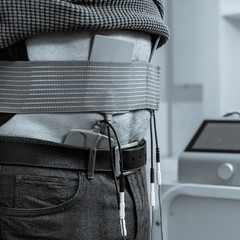 Closeup photo of spinal traction procedure in modern clinic black white image with a blue toning