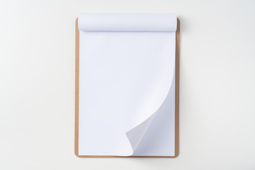 white flipped paper on clipboard isolated on white