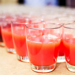 Tomato juice in a row