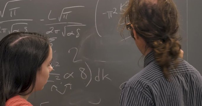 Two scientists or mathematicians agreeing on a solution to a complex problem
