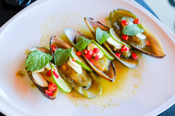 Mussels toping galic and lemon, fusion food