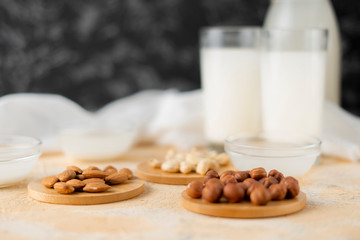 assorted nuts such as almond, cashew, hazelnut and milk in a glass bottle, healthy foods