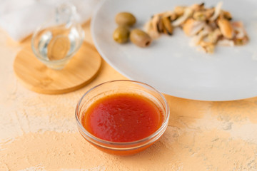 seafood such as shrimps, octopuses and mussels and special sauce in a glass cups