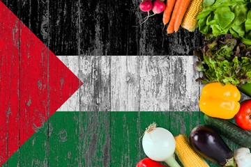Fresh vegetables from Palestine on table. Cooking concept on wooden flag background.
