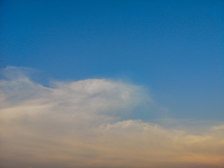 Deep blue sky and white cloud background.