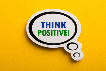 Think Positive Speech Bubble Isolated On Yellow Background