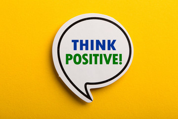 Think Positive Speech Bubble Isolated On Yellow Background