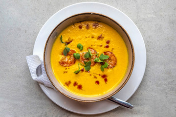 Tom yum soup with three shrimps on top