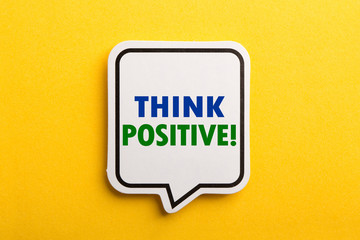 Think Positive Speech Bubble Isolated On Yellow Background