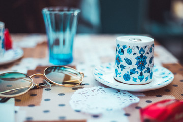 tea cup close up with sunglasses