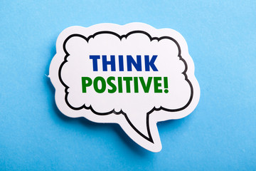 Think Positive Speech Bubble Isolated On Blue Background