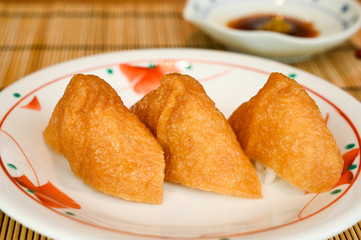 Inari sushi, deep fried tofu filled with rice (Japanese food)