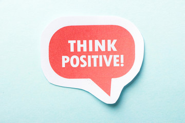 Think Positive Speech Bubble Isolated On Blue Background