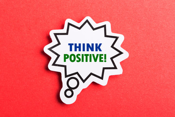 Think Positive Speech Bubble Isolated On Red Background