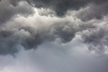 The storm clouds are blowing rain.