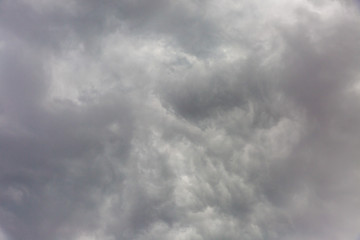 The storm clouds are blowing rain.
