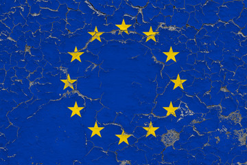 Flag of European Union painted on cracked dirty wall. National pattern on vintage style surface.