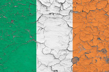 Flag of Ireland painted on cracked dirty wall. National pattern on vintage style surface.