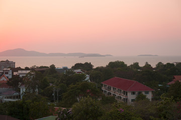 Sunset on the sea in a tropical city. Island vew.