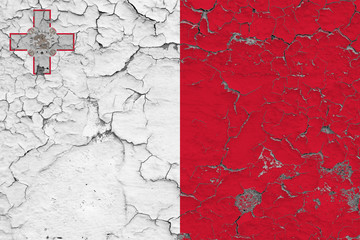 Flag of Malta painted on cracked dirty wall. National pattern on vintage style surface.