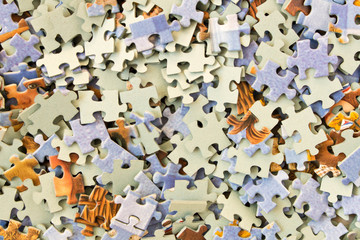 Abstract background of many different puzzles. The concept of teamwork.