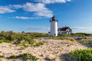 Fototapeta na wymiar Race Point Light Lighthouse in beach dunes on the beach at Cape Cod, New England, Massachusetts, USA