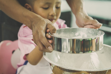 happy family in kitchen. family knead dough and bake the bakery together in kitchen