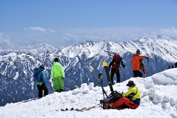 Backcountry skiing in Japan, mt. Tateyama : Skiers climbing up in the magnificent Japanese Alps and...