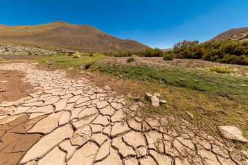 Climate change, dry sand where a while ago there was water now remains the eroded land making a...