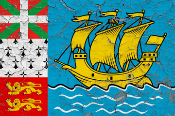 Flag of Saint Pierre And Miquelon painted on cracked dirty wall. National pattern on vintage style surface.