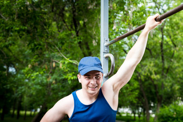 Portrait of attractive fitness man in the park