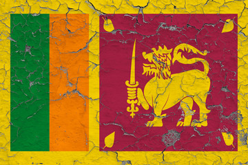 Flag of Sri Lanka painted on cracked dirty wall. National pattern on vintage style surface.