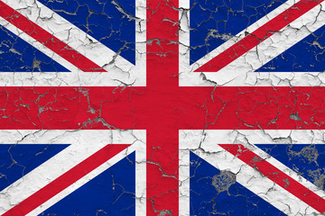 Flag of United Kingdom painted on cracked dirty wall. National pattern on vintage style surface.