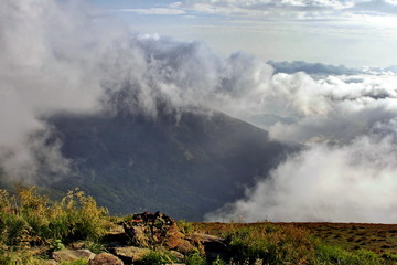 Fototapeta premium Clouds and fog over Carpathian mountains