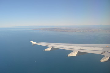 Fototapeta premium Airplane view above the water