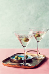 Martini cocktail with green olive
