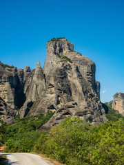 Fototapeta na wymiar Beautiful landscape overlooking the town of Kalambaka in the valley of the river Pinyos and the rock formations in the mountains in Meteora region, Greece