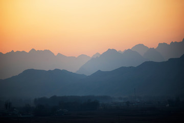 The misty peaks were at sunset