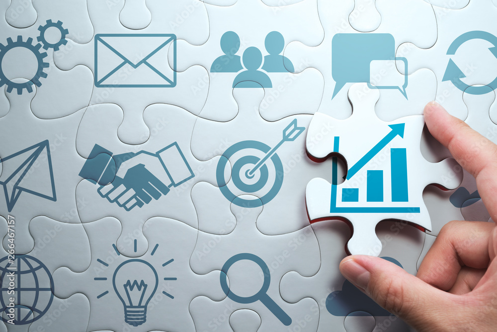 Aufkleber business development concept. finding solution to growth. connecting last jigsaw puzzle piece.