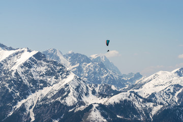 Naklejka na ściany i meble Paragliding over Alps
