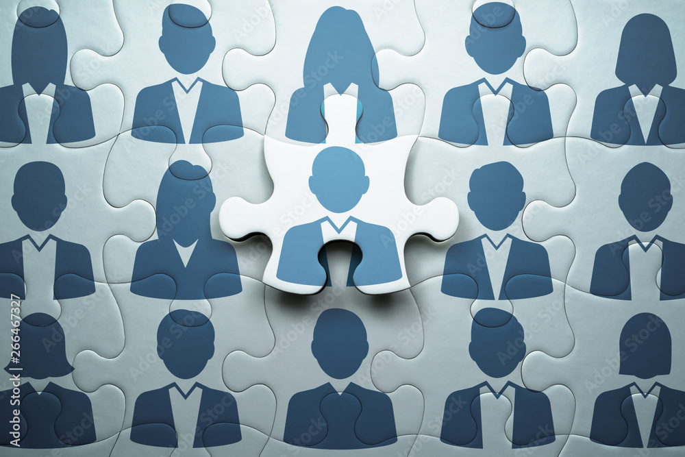 Poster Selecting person and building team. Human resource management and teamwork concept.Connecting last jigsaw puzzle piece.