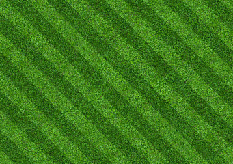 Fototapeta na wymiar Green grass soccer field background with abstract pattern.