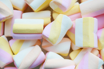Background of pastel pink yellow marshmallows