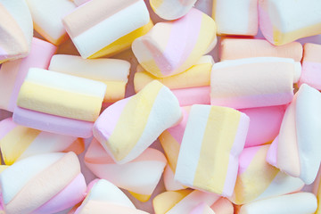 Background of pastel pink yellow marshmallows