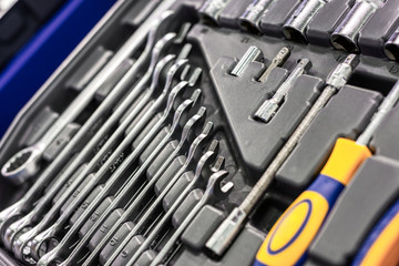 A set of wrenches in a plastic box. A set for car repair. Close-up photo.