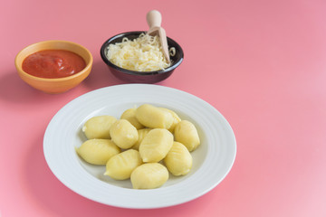gnocchi stuffed with pesto with homemade tomato sauce and cheese