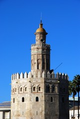Obraz premium Top part of the golden tower (Torre del Oro), Seville, Spain.