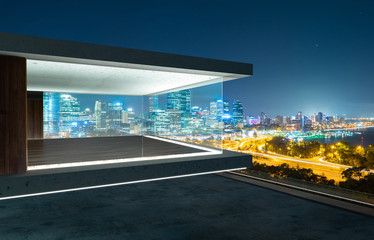 Empty glass wall balcony with city skyline view . Night scene .Mixed media .